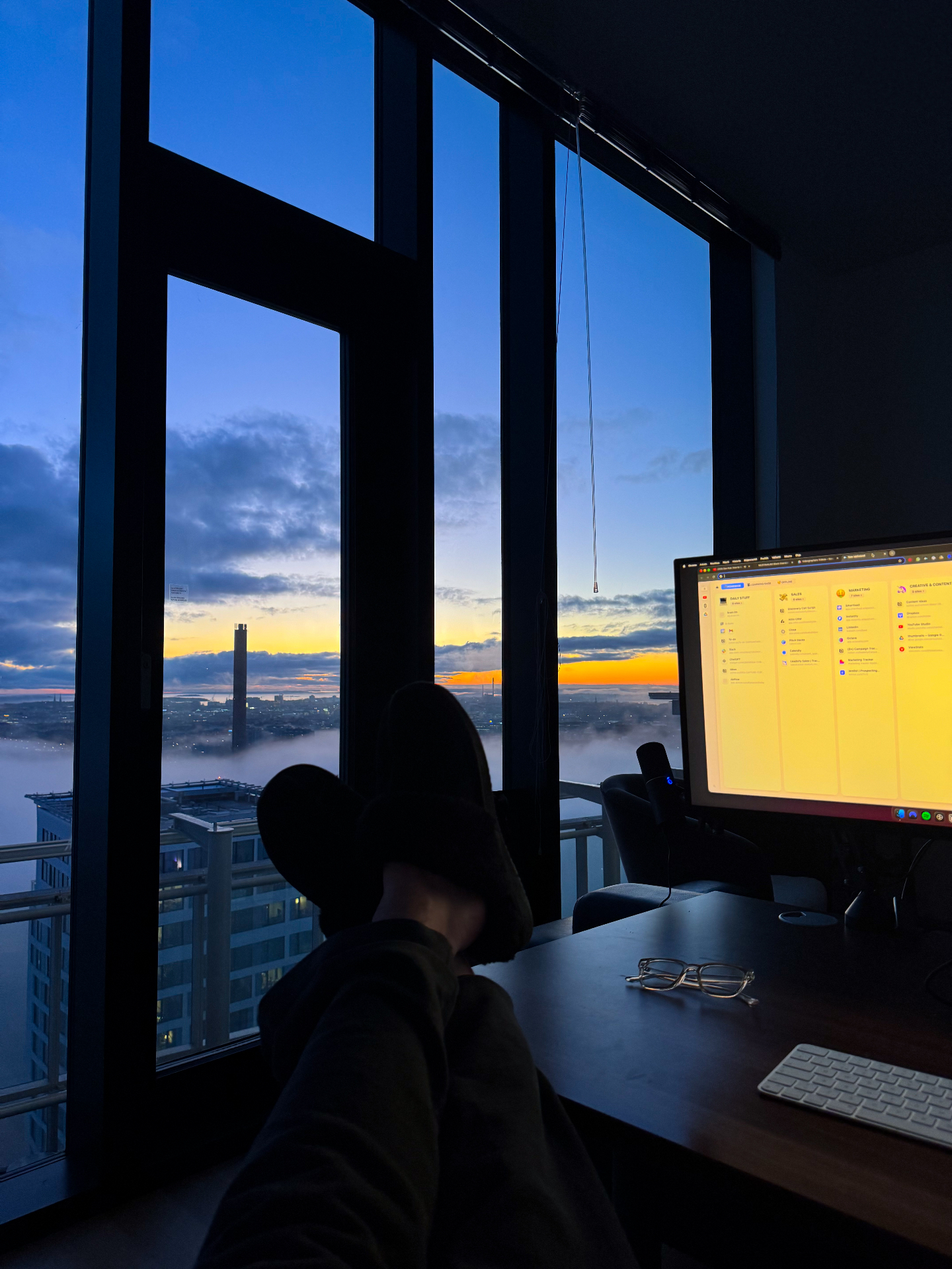 Early morning desk setup with business dashboard at sunrise